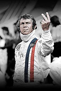 Steve McQueen gives a two-fingered salute.