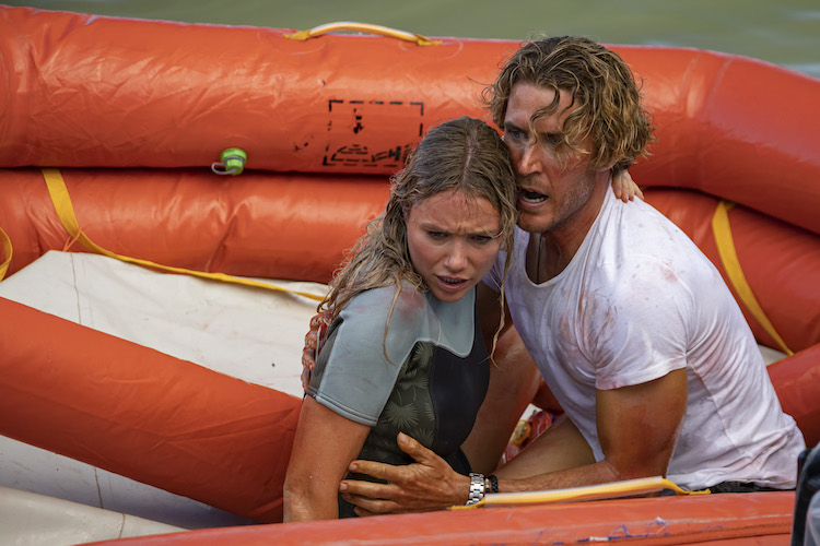 (L-R) Katrina Bowden as Kaz and Aaron Jakubenko as Charlie in the action- adventure/thriller, GREAT WHITE, an RLJE Films and Shudder release. Photo courtesy of RLJE Films and Shudder.