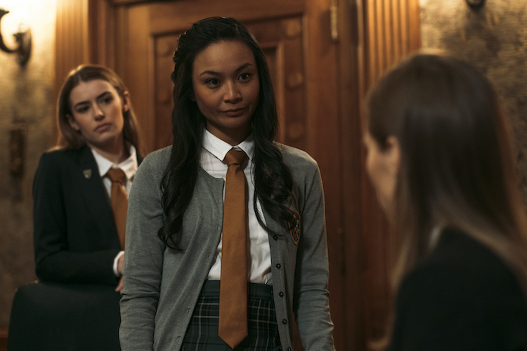 [L-R] Jade Michael as Lenora, Stephanie Sy as Yvonne, and Suki Waterhouse as Camille in the horror SEANCE, an RLJE Films and Shudder release. Photo courtesy of RLJE Films and Shudder.