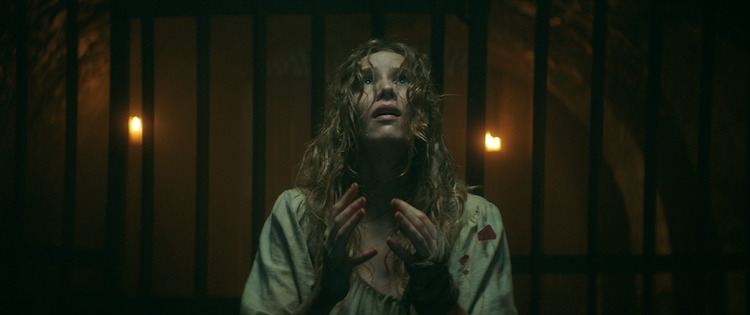 Charlotte Kirk as Grace Haverstock in the horror film, THE RECKONING, a RLJE Films/Shudder release. Photo courtesy of RLJE Films/Shudder
