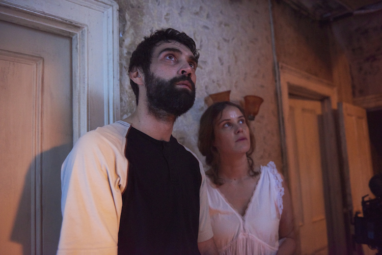 Alec Secareanu and Carla Juri in AMULET, a Magnet release. © Rob Baker Ashton. Photo courtesy of Magnet Releasing.