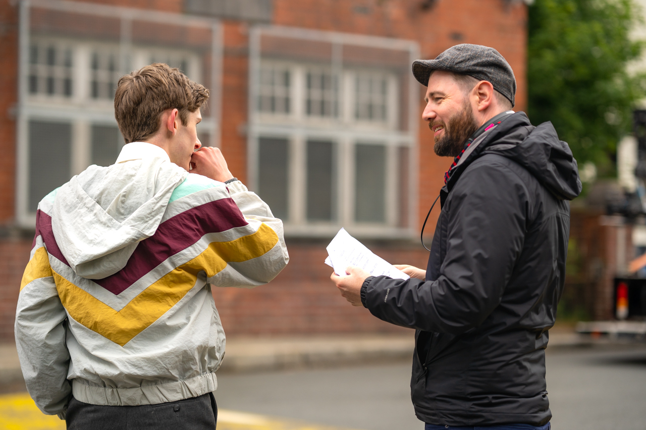 (L - R) Fionn O’Shea and writer/director, David Freyne , behind the scenes in the Comedy/ LGBTQ /Romance/Drama , DATING AMBER , a Samuel Goldywn Films release. Photo courtesy of Samuel Goldwyn Films