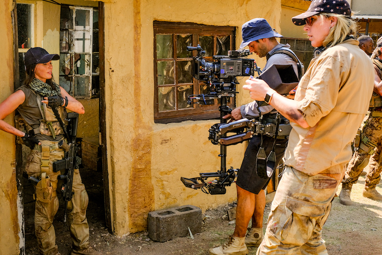 (L - R) Megan Fox and Director M.J. Bassett behind the scenes of the action / thriller film , “ ROGUE, ” a Lionsgate and Grindstone Entertainment Group, a Lionsgate Company release. Photo courtesy of Lionsgate