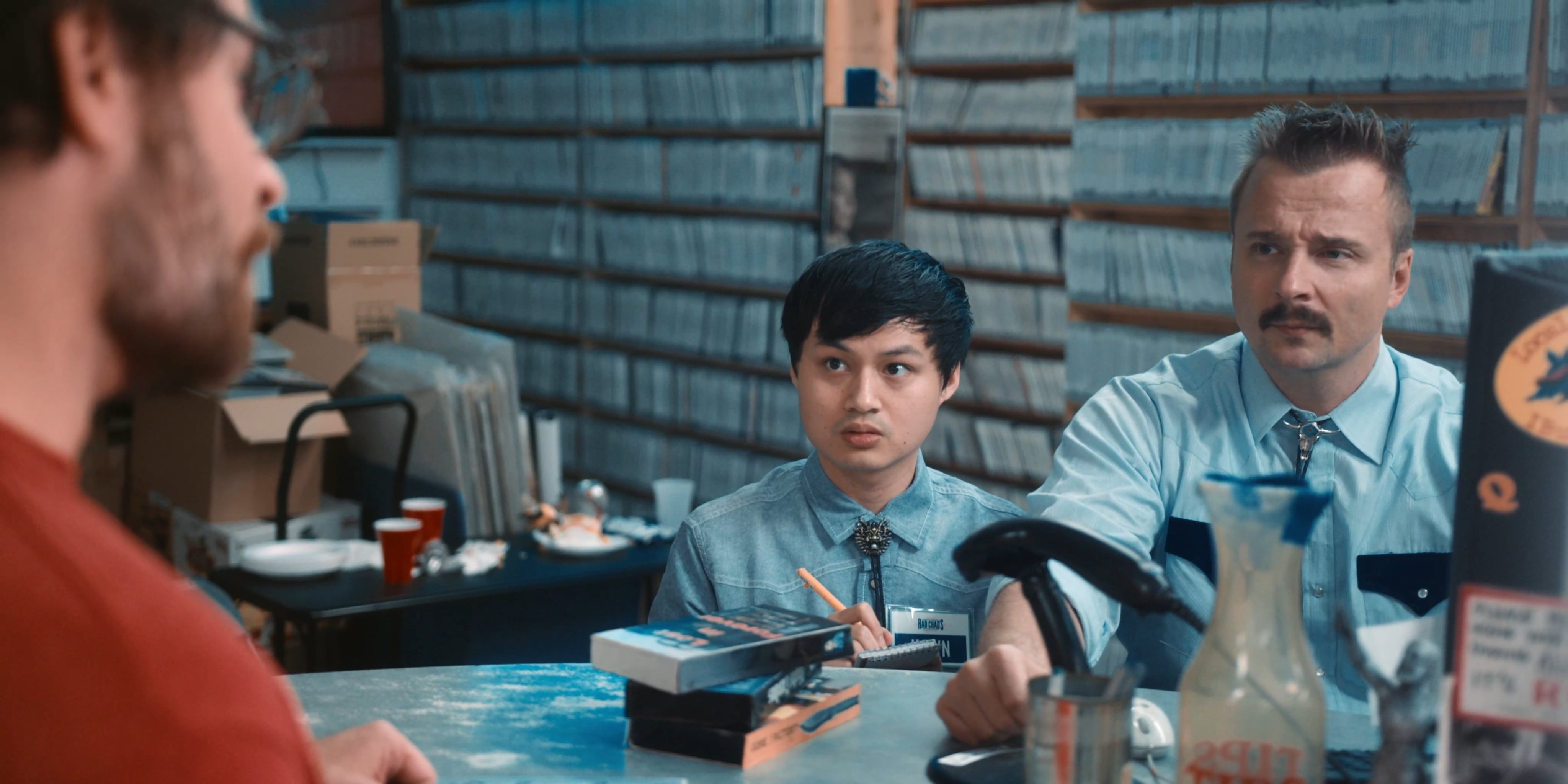 (L - R) Hawn Tran as Hawn and Jeremy King as Chad Buckley in the horror/comedy “ SCARE PACKAGE , ” a Shudder a nd RLJE F ilms release. Photo courtesy of Shudder and RLJE Films