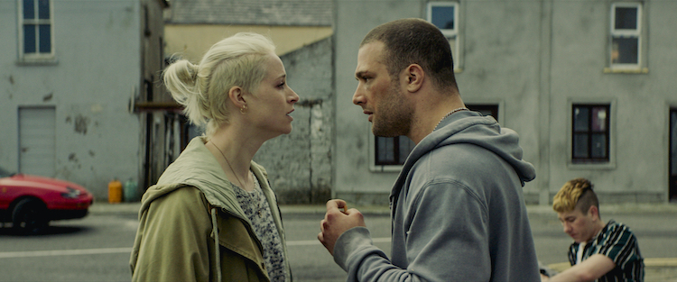 (L - R) Niamh Algar as Ursula Dory and Cosmo Jarvis as Douglas “Arm” Armstrong in the thriller film THE SHADOW OF VIOLENCE, a Saban Films release. Photo courtesy of Saban Films.