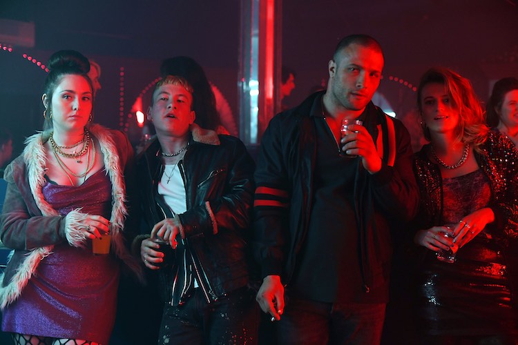 (L - R) Róisín O’Neill as Fatima , Barry Keoghan as Dympna Devers, Cosmo Jarvis as Douglas “Arm” Armstrong and Toni O’Rourke as Lisa in the thriller film THE SHADOW OF VIOLENCE, a Saban Films release. Photo courtesy of Saban Films.