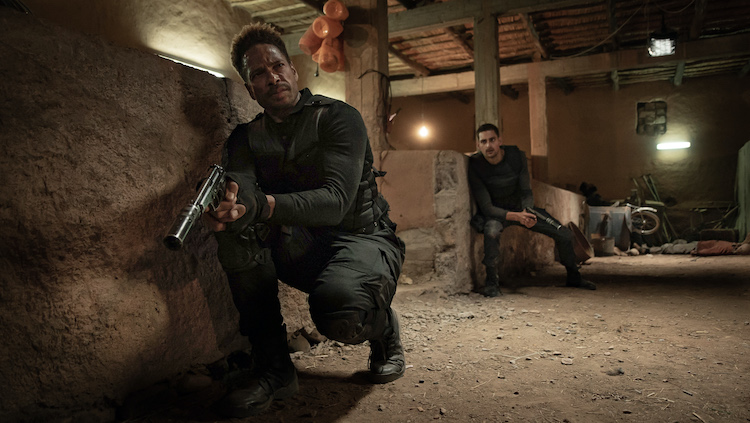 (L - R) Gary Dourdan as Brad Paxton and Brice Bexter as Youne s Laalej in the action film REDEMPTION DAY , a Saban Films release. Photo courtesy of Saban Films