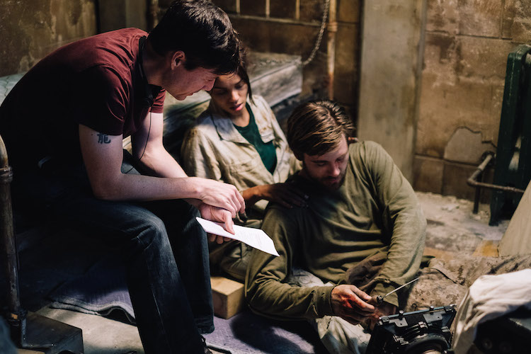 [L-R] Director, Jonathan W. Stokes, Georgina Campbell as Khadija Young, and Luke Benward as Luke White behind the scenes of the thriller WILDCAT, a Saban Films release. Photo courtesy of Saban Films.