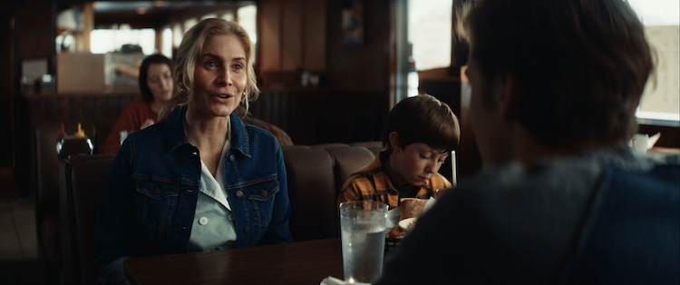 ALIENS ABDUCTED MY PARENTS AND NOW I FEEL KINDA LEFT OUT_7.jpg  (L-R) Elizabeth Mitchell as Vera and Kenneth Cummins as Evan in the sci-fi/comedy, ALIENS ABDUCTED MY PARENTS AND NOW I FEEL KINDA LEFT OUT, a Jespers Comet Films, LLC release. Photo courtesy of Jespers Comet Films, LLC.