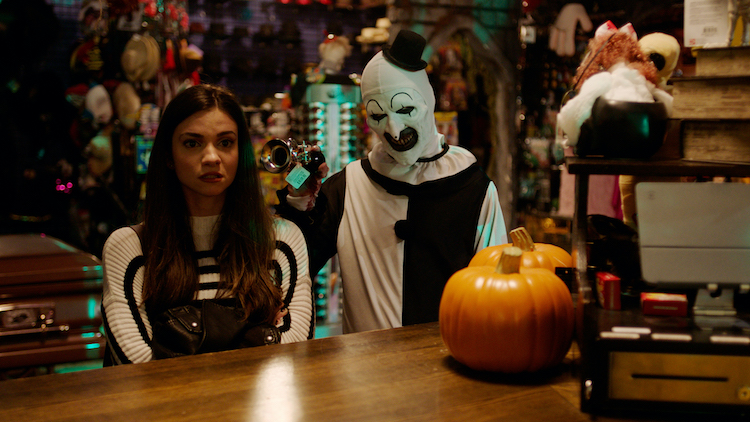 (L-R) Lauren LaVera as Sienna Shaw and David Howard Thornton as Art the Clown in the horror film, TERRIFIER 2, a CINEDIGM release. Photo courtesy of CINEDIGM.