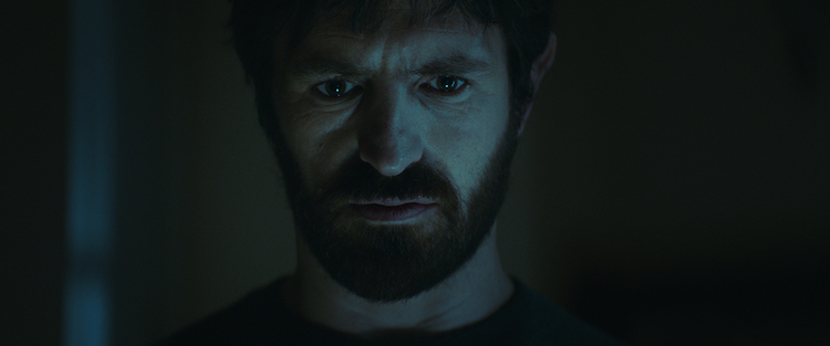 Eoin Macken as Brian in the horror film THE CELLAR, a SHUDDER/RLJE release Films. Photo courtesy of SHUDDER/RLJE Films.