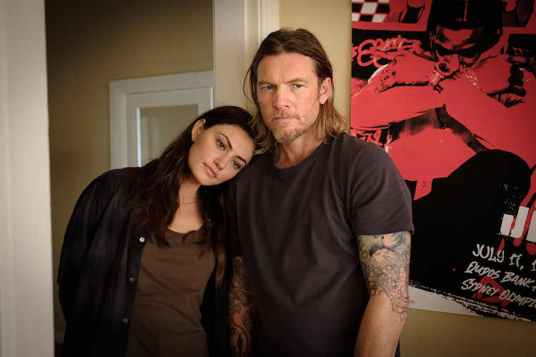 [L-R] Phoebe Tonkin as Justine and Sam Worthington as Ryan Logan in the thriller/action/crime  film, TRANSFUSION, a Saban Films release. Photo courtesy of Saban Films.