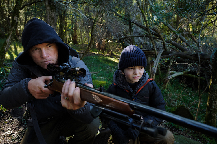 [L-R] Sam Worthington as Ryan Logan and Gilbert Bradman as Billy in the thriller/action/crime  film, TRANSFUSION, a Saban Films release. Photo courtesy of Saban Films.