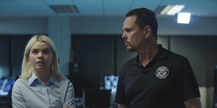 [L-R] Shelby Cobb as Nour Holborow and Kevin Dillon as Justin Rosa in the action film, WIRE ROOM, a Lionsgate release. Photo courtesy of Lionsgate.