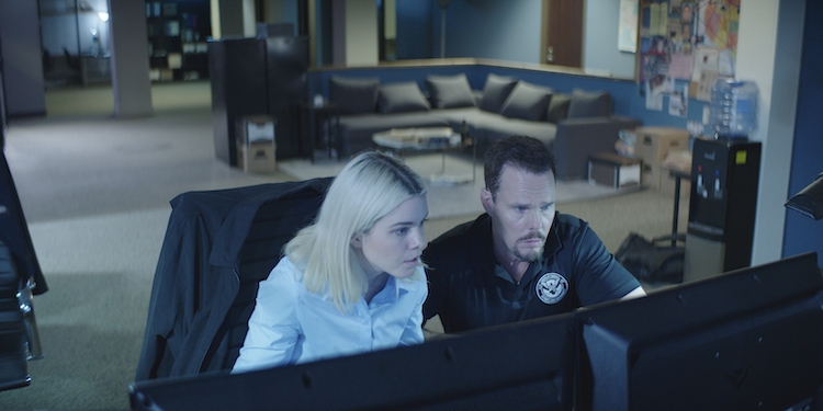 [L-R] Shelby Cobb as Nour Holborow and Kevin Dillon as Justin Rosa in the action film, WIRE ROOM, a Lionsgate release. Photo courtesy of Lionsgate